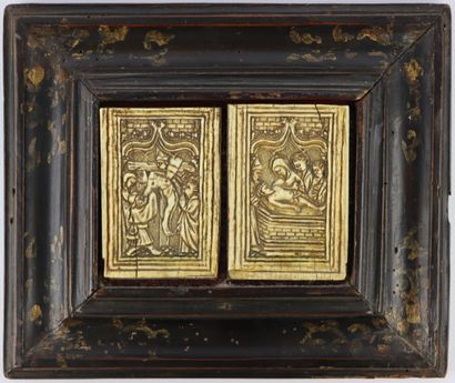 null Two ivory plates in a single wooden frame depicting the descent from the cross...