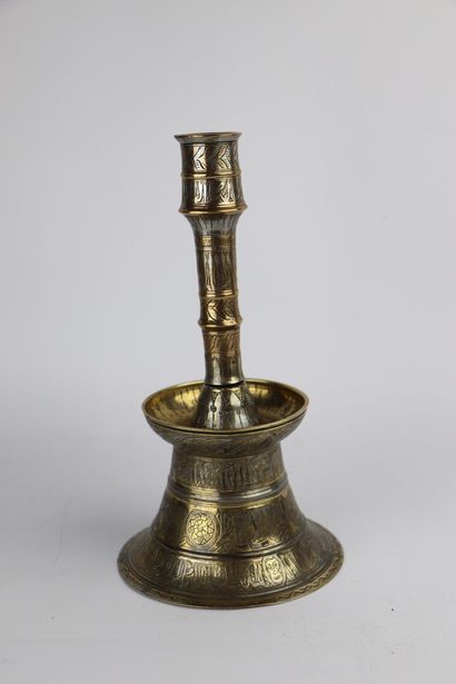 null Brass and silver candlestick, in the style of Mamluk productions.

Ancient work.

H_24...