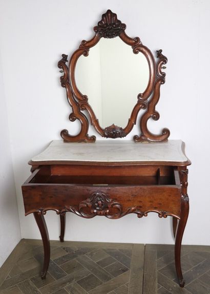 null Moulded and carved mahogany dressing table opening to a drawer in front. White...