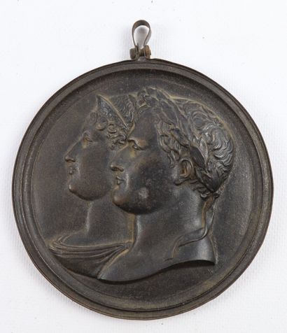 null A cast iron medallion showing the profiles of the Emperor Napoleon I and the...