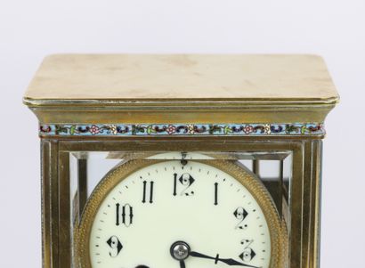 null Brass clock decorated with friezes in polychrome cloisonné enamel. 

The four...