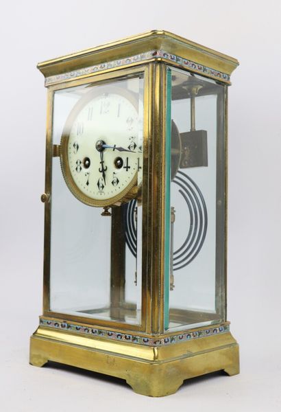 null Brass clock decorated with friezes in polychrome cloisonné enamel. 

The four...