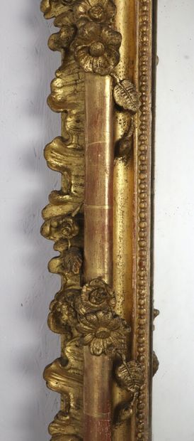 null Large rectangular mirror in wood and gilded stucco, the pediment openwork with...