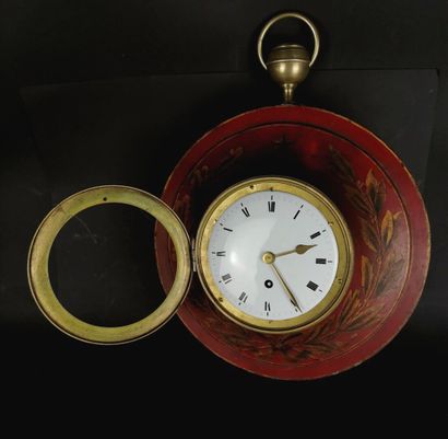 null A brass and red lacquered sheet metal wall clock with gold decoration of laurel...