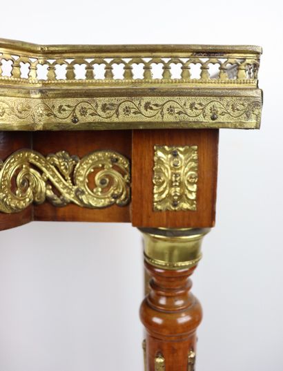 null A moulded and carved wooden saddle with a central projection decorated with...