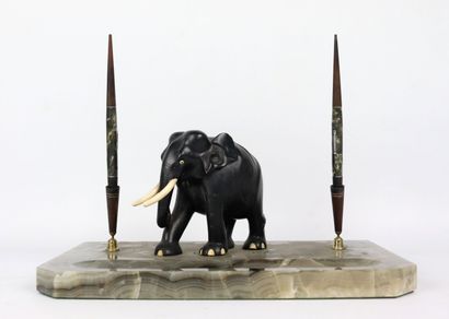 null Onyx penholder supporting an ebony elephant sculpture and ivory tusk, as well...