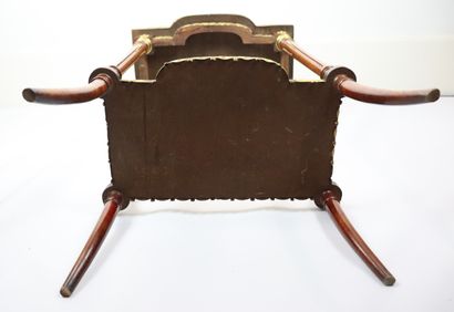 null A moulded and carved wooden saddle with a central projection decorated with...