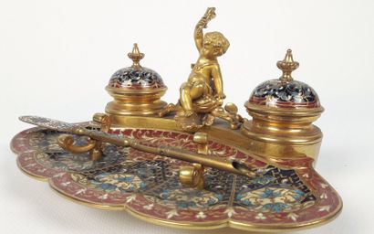 null An ormolu and polychrome cloisonné enamel inkwell with a profusion of foliage.

It...