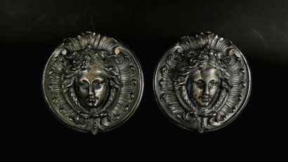 null A pair of silver plated bronze door handles decorated with a woman's mask in...