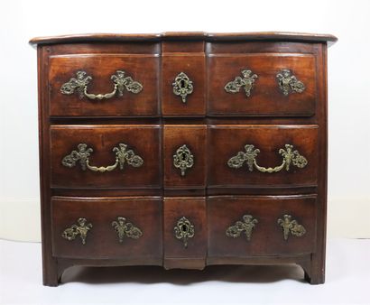 null Molded wood chest of drawers opening to three drawers 

Ornamented with gilt...