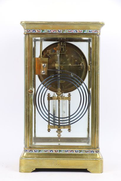 null Brass clock decorated with friezes in polychrome cloisonné enamel. 

The four...