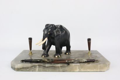 null Onyx penholder supporting an ebony elephant sculpture and ivory tusk, as well...