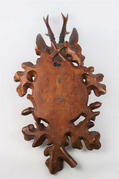 null Carved wooden hunting trophy representing a deer head in a frame decorated with...