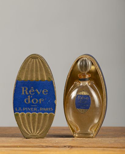 null L.T. PIVER.

Rêve d'or.

Flacon à parfum amphore en verre, dessiné par Süe et...