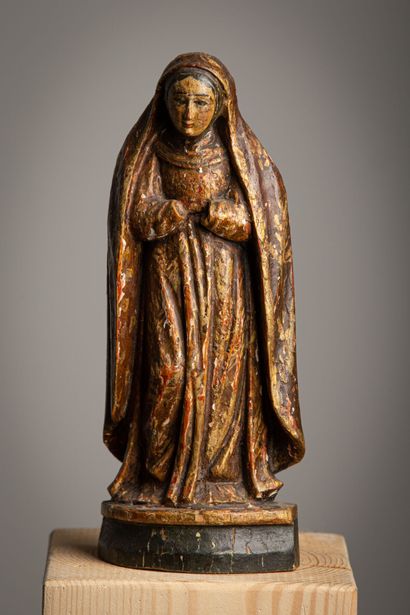 null Vierge en bois sculpté, peint et doré.

Epoque XVIIIème siècle.

H_23 cm

manque...