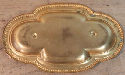 null Tray of mass cruets in gilt bronze. 
The wing curved with pearl stripe. 
Decorated...