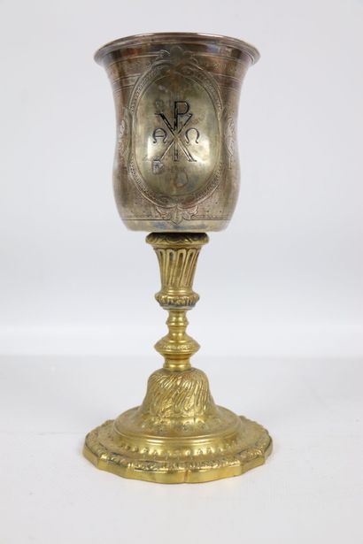 null Chalice in silver and gilded metal. 
The silver container with medallion decoration...