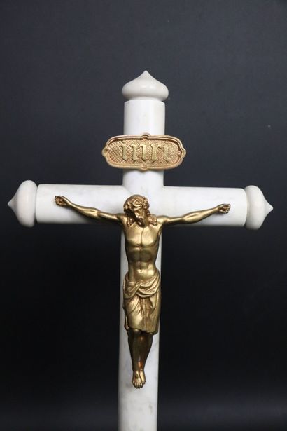 null Crucifix in marble and gilt bronze. 
The heptagonal base.
Surmounted by a gilded...