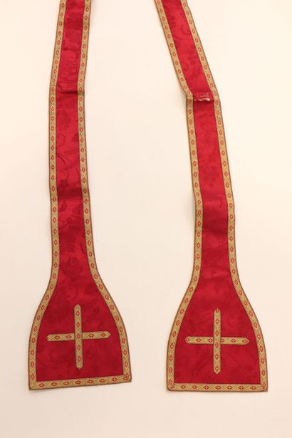 null Two religious stoles in red silk fabric and braids. 
Decorated with a cross...