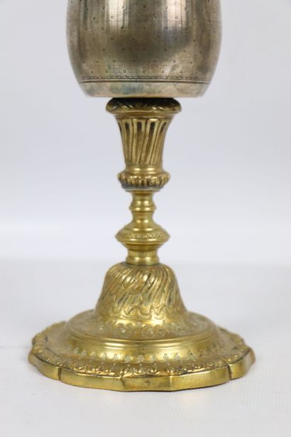 null Chalice in silver and gilded metal. 
The silver container with medallion decoration...