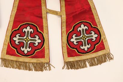 null Meeting of two religious stoles and a religious square in red fabric with foliage....
