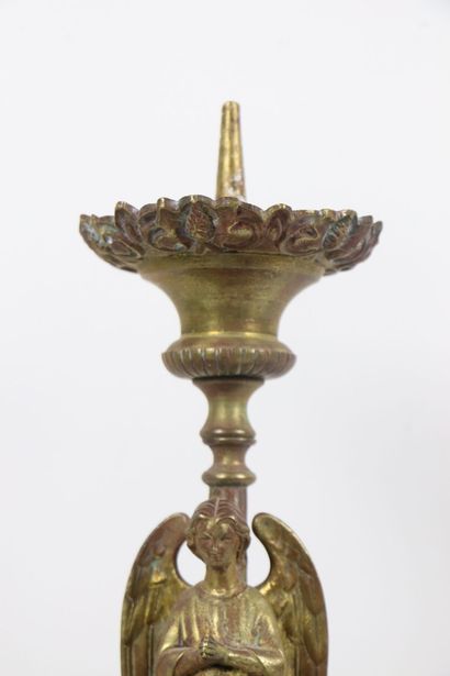 null Gilded bronze pedestal, the shaft showing an angel praying on a tripod base...