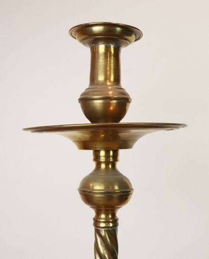 null Important brass candle holder with twisted column. 
Circular base with a gadrooned...