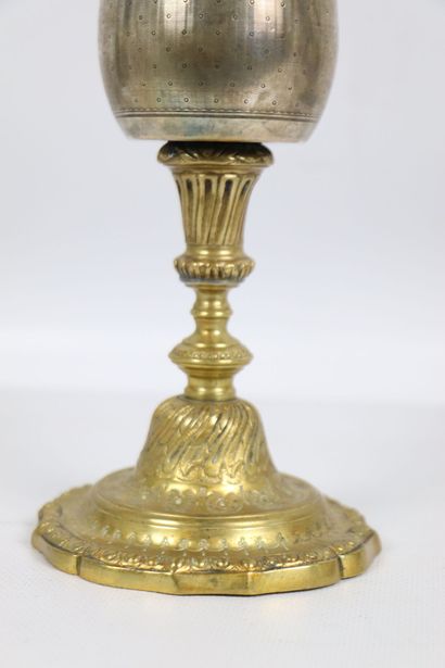 null Chalice in silver and gilded metal. 
The silver container with medallion decoration...