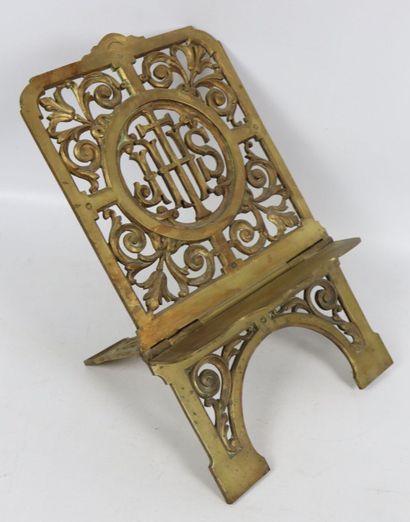 null Gilt bronze lectern decorated with a cross and the inscription IHS in a frame...