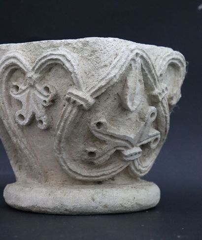 null Carved limestone corner capital featuring stylized vine leaves. 
Element of...