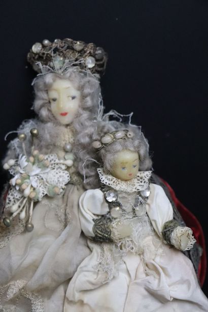 null The Holy Virgin and the Child Jesus.
Wax figures, they are richly dressed with...