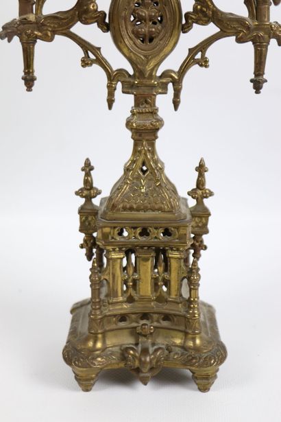 null Pair of gilt bronze candlesticks with gothic architecture decoration. 
They...