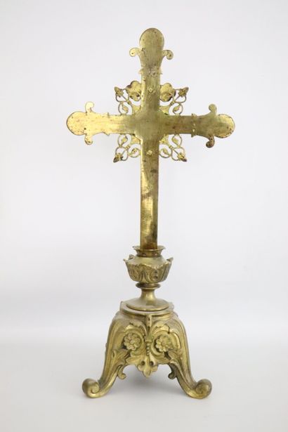 null Altar crucifix in gilt bronze with rich openwork decoration. 
The tripod base...