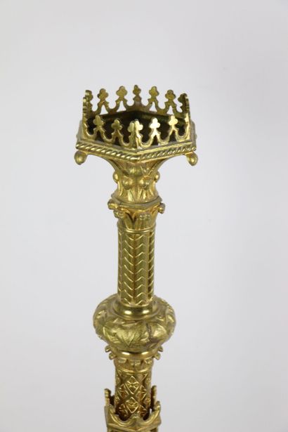 null Important gilded bronze candlestick with rich decoration of a gothic architecture.
The...