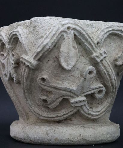 null Carved limestone corner capital featuring stylized vine leaves. 
Element of...