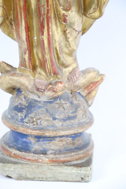 null The Holy Virgin.
Sculpture in plaster and polychrome stucco. 
She is wearing...