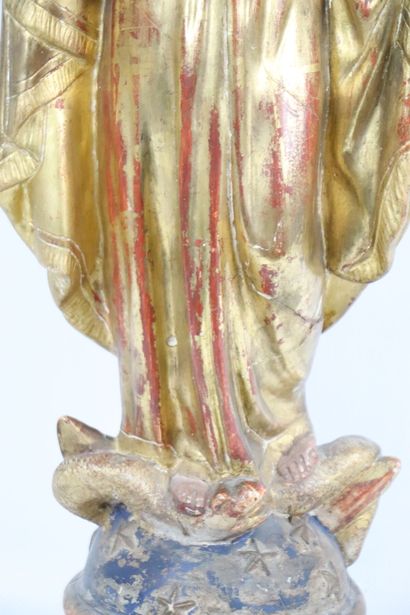 null The Holy Virgin.
Sculpture in plaster and polychrome stucco. 
She is wearing...