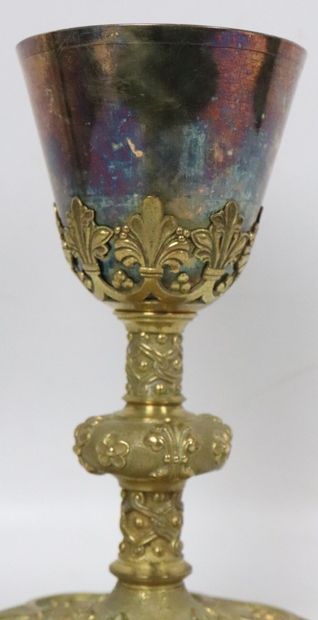 null Bronze chalice richly decorated with a gothic foliage. 
The container in silver...
