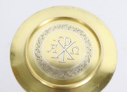null Paten in vermeil decorated with the Christ mark surrounded by a frieze of vine...