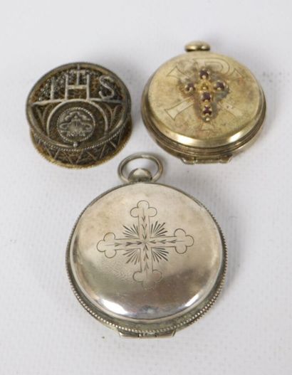 null Meeting of two silver host boxes. 
One circular with a christic motif bearing...