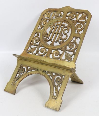 null Gilt bronze lectern decorated with a cross and the inscription IHS in a frame...