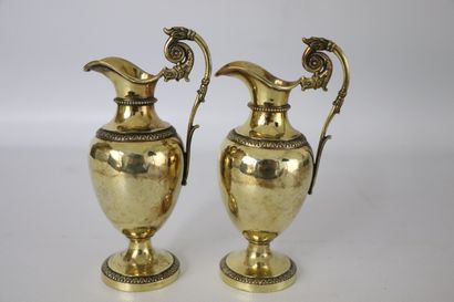null Cruets in vermeil with decoration of friezes of leaves of refends. 
The handle...
