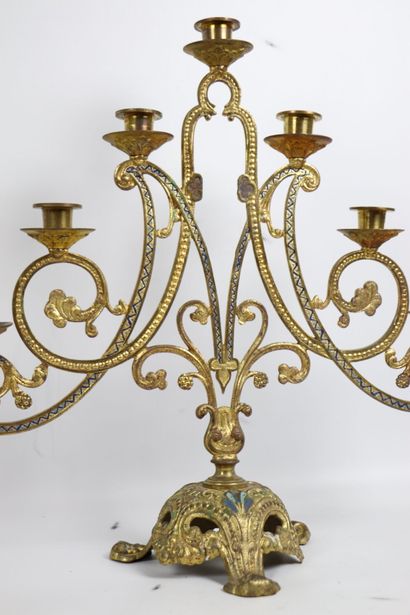 null Pair of candlesticks in gilded metal, openwork and partially painted. 
They...