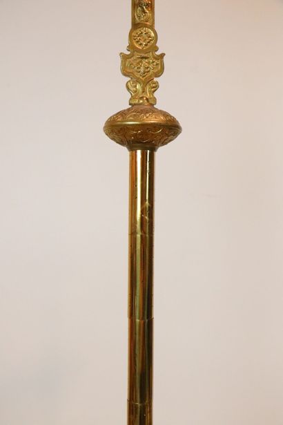 null Processional cross in bronze and brass decorated with a Christ. 
The shaft ringed....