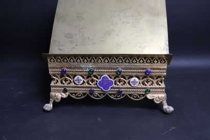 null Brass lectern with filigree cross decoration. 
The contour with decoration of...