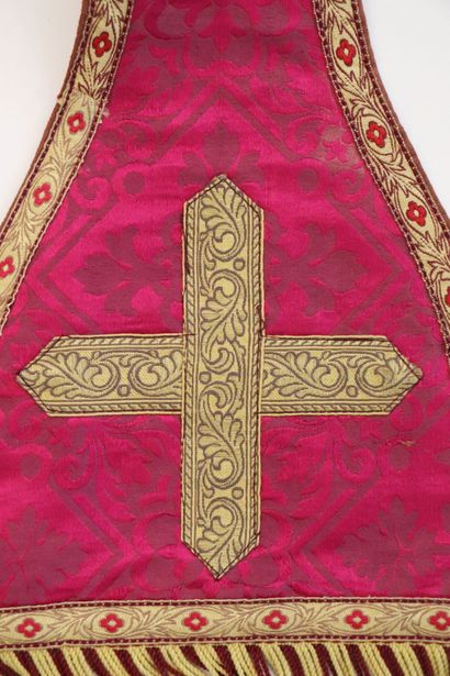 null Religious stole in red fabric decorated with foliage medallions. 
The braids...