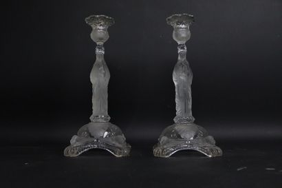 null PORTIEUX. 
Pair of candlesticks out of pressed crystal moulded with decoration...
