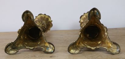 null Pair of gilded bronze candlesticks.
The shaft with twisted nets and globe decorated...