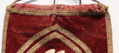 null Religious banner in red velvet decorated with an embroidered medallion showing...