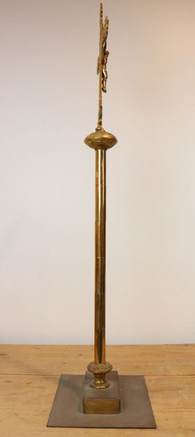 null Processional cross in bronze and brass decorated with a Christ. 
The shaft ringed....